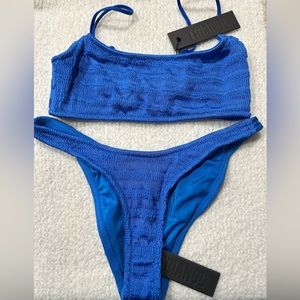 NWT blue Triangl Mica bikini w/ zipper bag. Medium top and small bottom.